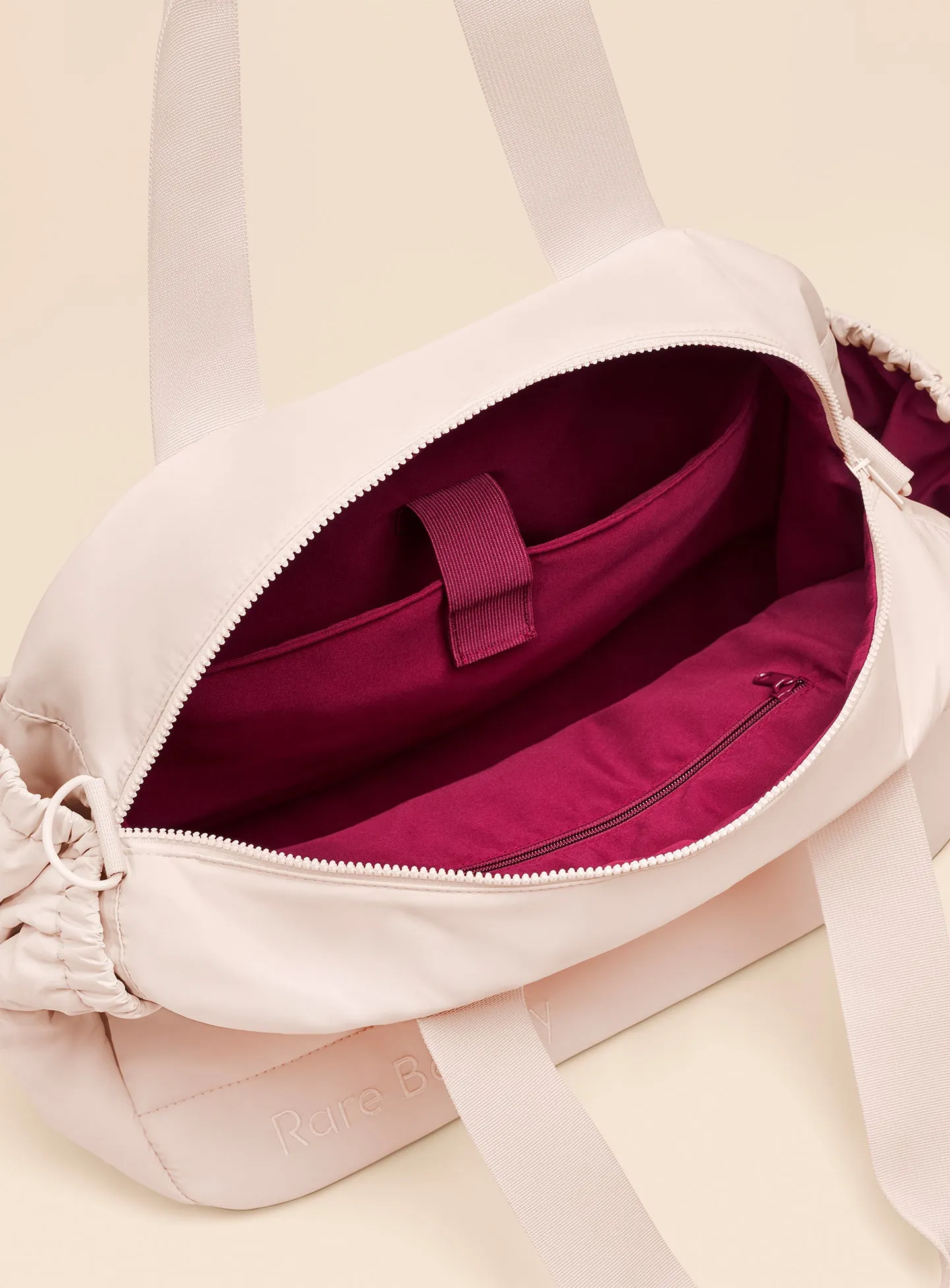 ECOMM-PUFFY-CARRYALL-TOTE-PEACH-04.webp