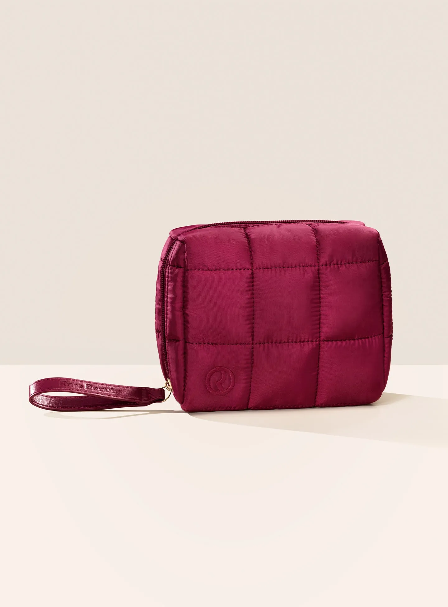 ECOMM-PUFFY-ESSENTIALS-POUCH-MERLOT-01.webp