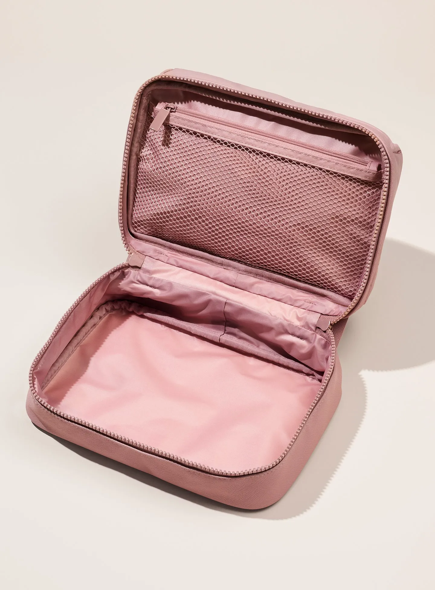 pdp-puffy-toiletry-bag-mauve-top-open.webp